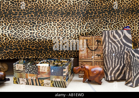 South African arts and crafts against an animal skin patterned background Stock Photo