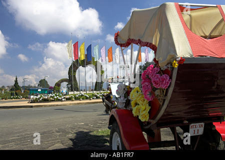 Horse and carriage outside plant arches entrance to Dalat Flower Gardens Dalat south east Vietnam Stock Photo