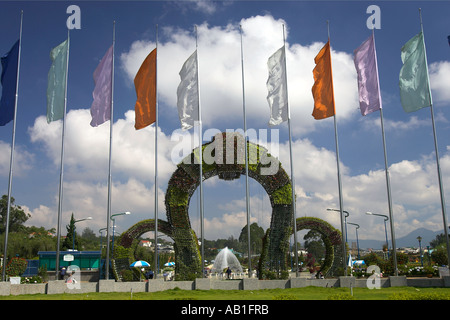 Flags fountain and entrance plant arches Dalat Flower Gardens Dalat south east Vietnam Stock Photo