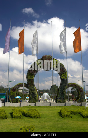 Flags fountain and entrance plant arches Dalat Flower Gardens Dalat south east Vietnam Stock Photo