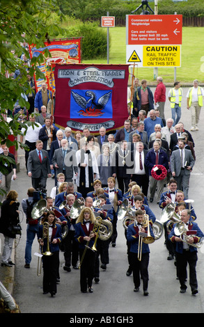 Workers and their families march under trade union banners and led by a brass band from Corus Ebbw Vale tinplate works Wales UK Stock Photo