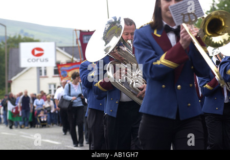 Workers and their families march under trade union banners and led by a brass band from Corus Ebbw Vale tinplate works Wales UK Stock Photo