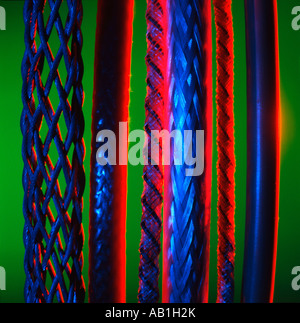 assorted cables against green background Stock Photo