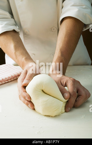 Kneading pizza dough FoodCollection Stock Photo - Alamy