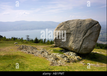 wide angle of the The cloughmore stone on Slieve Martin and carlingford lough below near Rostrevor Stock Photo