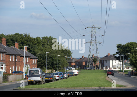 ELECTRICITY PYLON AND CABLES NEAR TO HOUSE Stock Photo