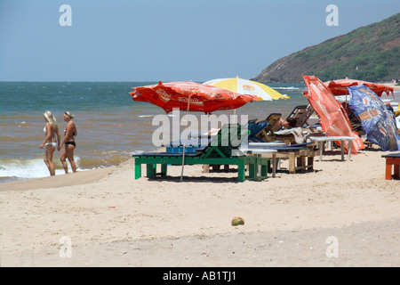 Two bikini women cool off at Anjuna Beach Goa India Stock Photo