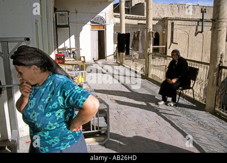 Women on balcony patio outside house in Armenian quarter in Esfehan, Iran, Middle East Stock Photo