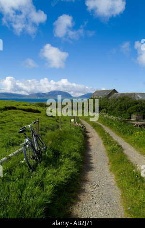 dh Bay of Ireland STENNESS ORKNEY Bicycle at side of farm track Burn of Ireland mill stream country lane parked bike tourist pushbike Stock Photo