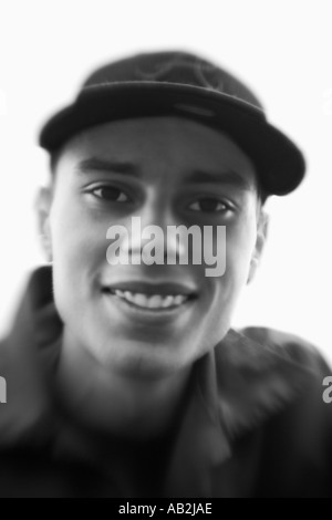 Young man wearing baseball cap smiling portrait close up Stock Photo