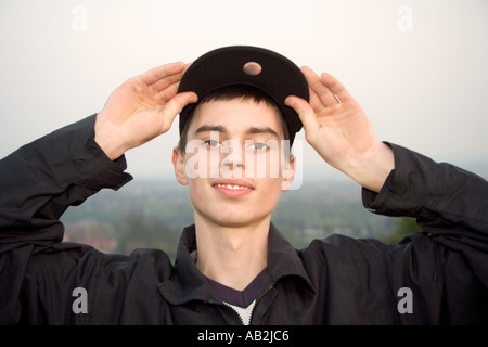 Young man wearing baseball cap smiling portrait close up Stock Photo