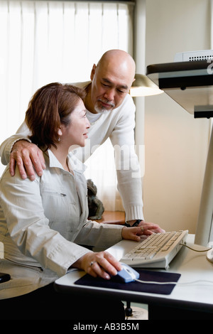 Senior couple using computer Stock Photo