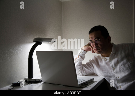 Mature man using computer Stock Photo
