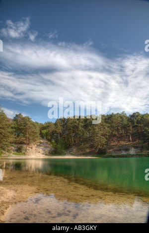 High Dynamic Range picture of the Blue Pool Furzebrook Wareham Dorset UK on a calm day in summer Stock Photo