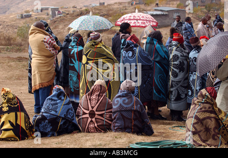 Basotho women and men covered in traditional blankets to keep warm during winter  in Lesotho Stock Photo