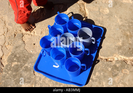 Cups of fresh safe drinking water for children in an orphanage in Maseru, Lesotho Stock Photo