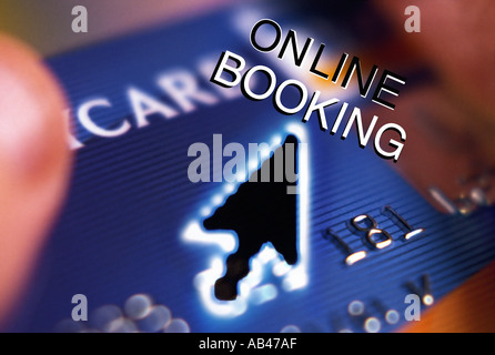 Online booking Hand holding bank card plus computer cursor Stock Photo