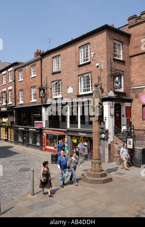 Chester. The sandstone Cross at the junction of Eastgate Bridge Street and Watergate Street in the historic walled city. Stock Photo