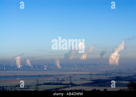 Steam rising from the chemical industry on the banks of the River Mersey Stock Photo