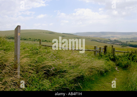 Footpath and signpost in open countryside along South Downs Way Stock Photo