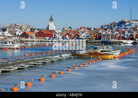 Boat and buoys in harbour, Skärhamn, Bohuslän, Sweden Stock Photo