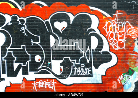 Graffiti on a brick wall, Barcelona, Spain Stock Photo