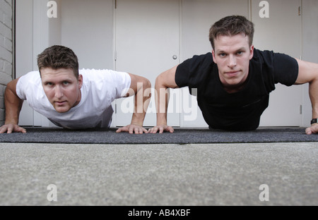 two young men doing pushups Stock Photo