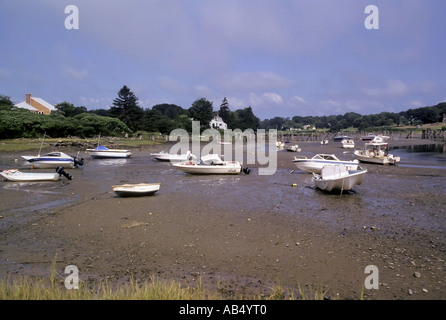 Boats rest on ground at low tide in a small harbor in Ogunquit Maine ME Stock Photo