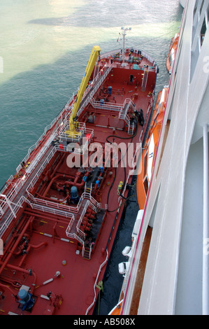 Fuel barge alongside cruise ship Ocean Village Two in Barcelona, Catalonia, Spain Stock Photo