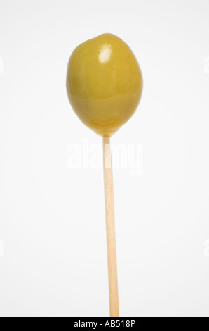 Green olive on toothpick Stock Photo