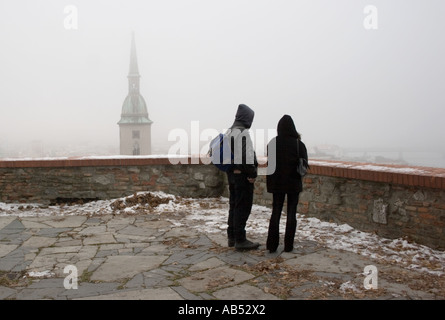 Spire of St Martins Cathedral in the mist viewed from Bratislava Castle Stock Photo