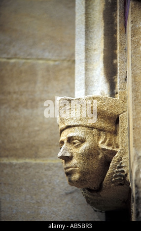 A carved stone head on the wall of an Oxford University college. Stock Photo