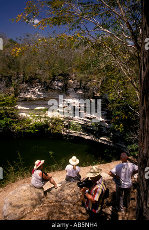 tourists, elder travel, Sacred Well, Cenote, Chichen Itza Archaeological Site, Chichen Itza, Yucatan State, Yucatan Peninsula, Mexico Stock Photo