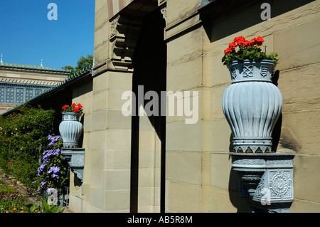 Flower pots hanging on a wall Stock Photo