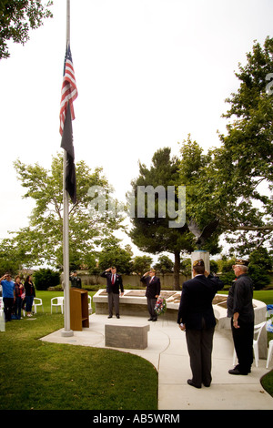 Veterans of Foreign Wars salute flags on Memorial Day Stock Photo