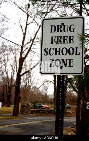 Drug free zone road sign by American school. Stock Photo