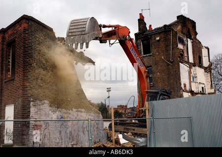 Lambeth Council digger demolishing the last remaining house Negusa Negast-3  from St Agnes Place Kennington a street in South Lo Stock Photo