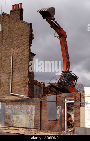 Lambeth Council digger demolishing the last remaining house Negusa Negast-3  from St Agnes Place Kennington a street in South Lo Stock Photo