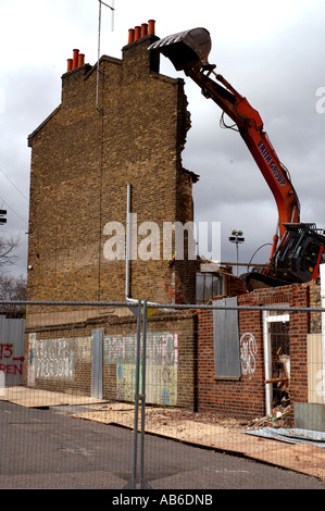 Lambeth Council digger demolishing the last remaining house Negusa Negast-3  from St Agnes Place Kennington a street in South Lo Stock Photo