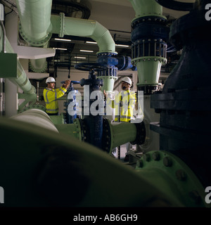 Engineers controlling water supply at water treatment plant, Izmit, Turkey, Stock Photo
