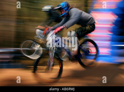 Two riders land after a jump at the NPS 4X championship round at Chicksands, Bedfordshire, 2007. Stock Photo