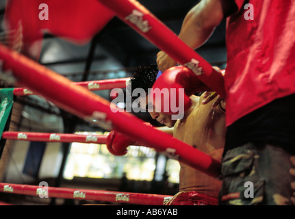 A boxer takes a break during a Khmer Kick Boxing match in Phnom Penh Cambodia Stock Photo