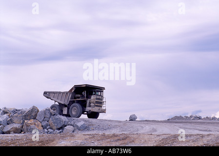 Limestone Quarry, Texada Island, BC, British Columbia, Canada - 100 Ton Dump Truck returns to pick up Load of Lime Stone at Mine Stock Photo