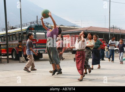 Indigenous children playing basketball in Santiago de Atitlan, Lake Atitlan, Guatemala Stock Photo