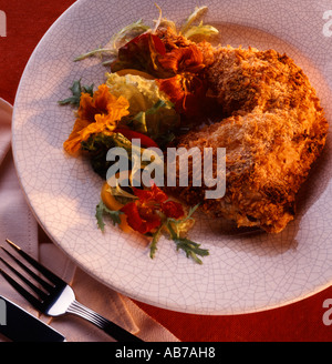 Fried chicken with nasturtium salad Stock Photo
