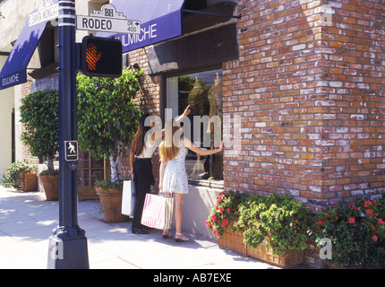 Two Asian women with shopping bags on Rodeo Drive in Beverly Hills Stock  Photo - Alamy