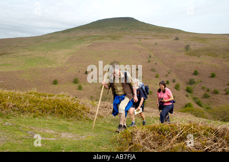 Guided walking group on footpath to Sugar Loaf mountain Abergavenny Monmouthshire South Wales UK