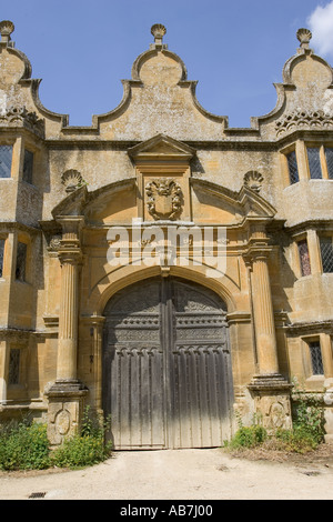 Gatehouse to Stanway Manor House built in Jacobean period architecture 1630 in Guiting yellow stone Stanton Cotswolds UK Stock Photo