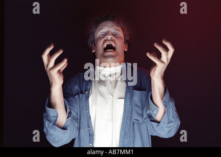 Screaming man yells fear and frustration concepts Stock Photo