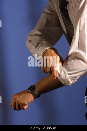 Rolling up sleeves Stock Photo